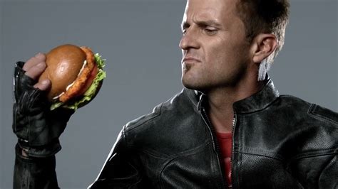 new carl s jr ads let men get sexy with sandwiches eater