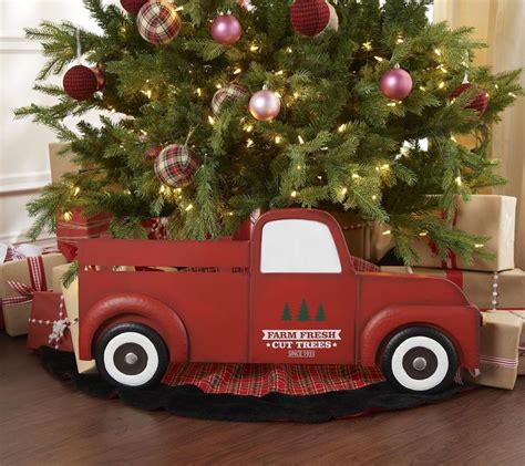 A Christmas Tree In A Red Truck With Ornaments On The Top And Presents