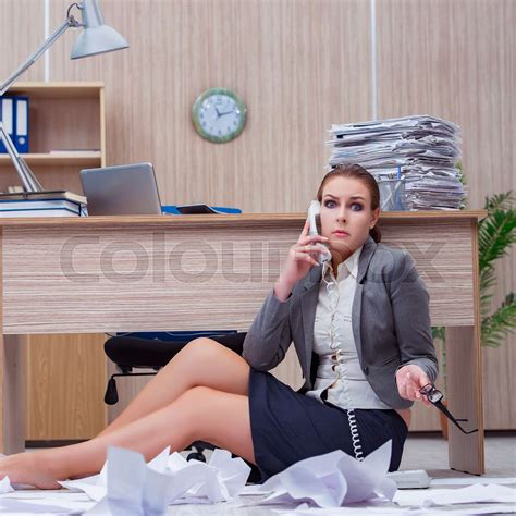 busy stressful woman secretary under stress in the office stock image