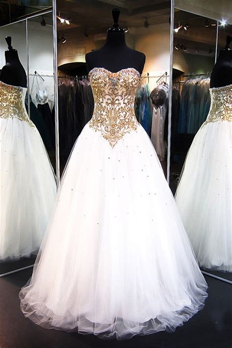 If you love the look of gold dresses, but you're craving even more sparkle, check out the glittering designs available in the metallic dress or the sequin dress sections! A Line Strapless White Tulle Gold Lace Beaded Prom Dress ...
