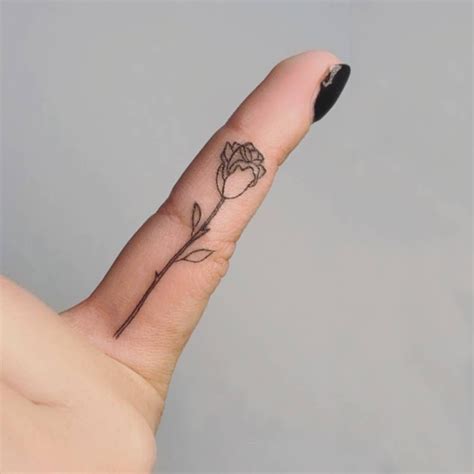 Fine Line Rose Tattoo On The Pinky Finger Finger Tattoo For Women