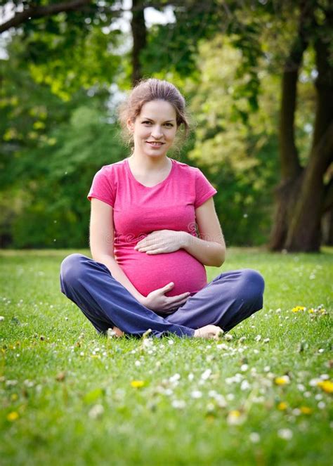 Beautiful Pregnant Woman Relaxing In The Park Stock Photo Image Of
