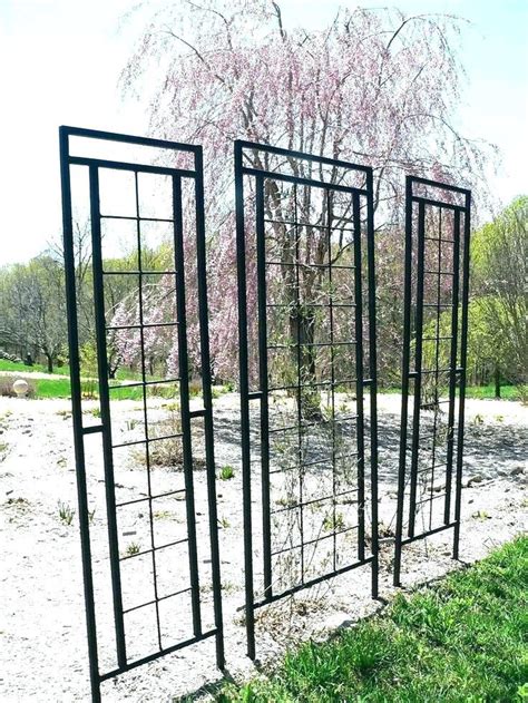 Planter holders can also be installed so you can get a head start and add perennial bursts of color. Garden Trellises Modern Metal Trellis ... | Treillis jardin, Beaux jardins, Pergola terrasse