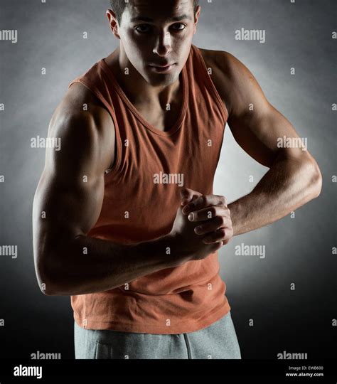 Young Man Showing Biceps Stock Photo Alamy