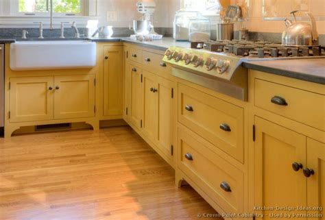 Things for our kitchen are bopping along now and with finishing the floors we get to do this little project that makes such a difference for the feel of our cabinets. Traditional Yellow Kitchen with a Custom Wood Island