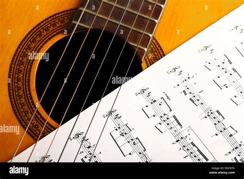 A Classical Guitar And A Music Sheet Stock Photo Alamy