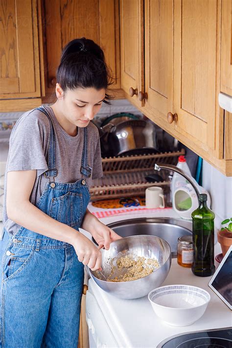 Woman Cooking At Home With Her Ipad Stocksy United Moms Cooking