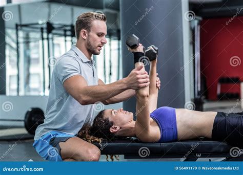 A Muscular Woman Lifting Dumbbells Stock Image Image Of Health
