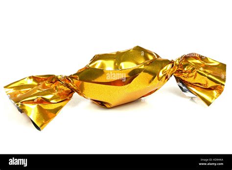 Candy In Golden Wrapper Isolated On White Background Stock Photo Alamy