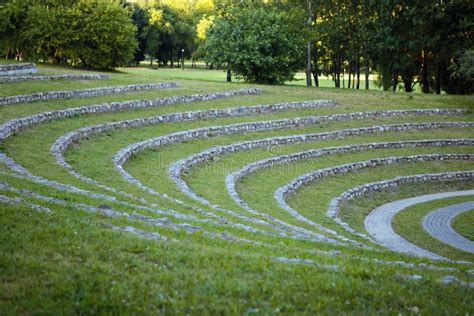 Original Amphitheater Of Grass And Stones In The Park Stock Photo