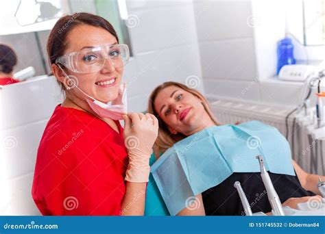 A Dentist Finishes A Successful Dental Restoration A Doctor Advises A