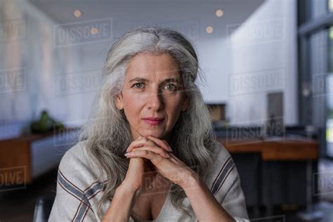 portrait-confident,-serious-mature-woman-with-long,-gray-hair-stock
