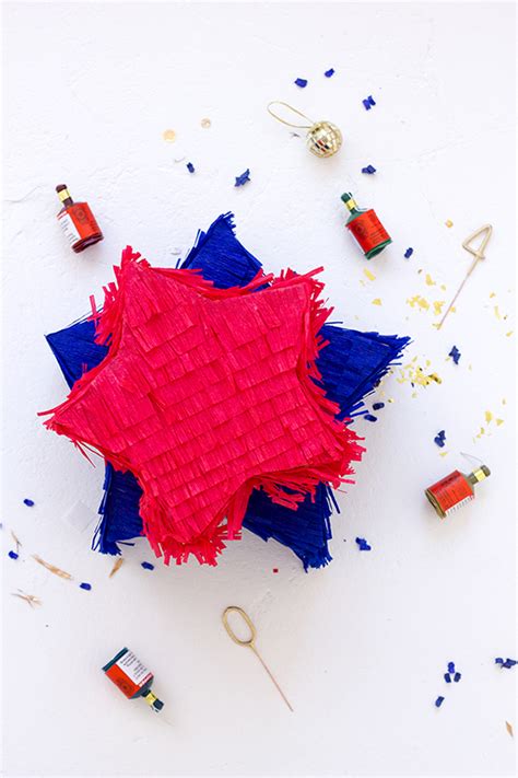 Bright striped colorful pinata isolated on white background. DIY Star Piñatas