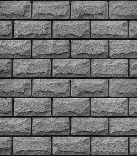 A Black And White Photo Of A Wall Made Out Of Stone Blocks With No Mortars