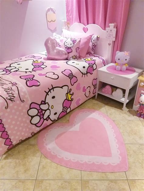 a bedroom with hello kitty bedding and pink curtains