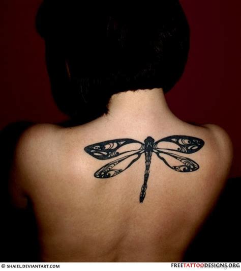 Tribal designs often stray from traditional formats, sometimes creating unique lines and shapes for the wings. 50 Sweetened Dragonfly Tattoo On Back