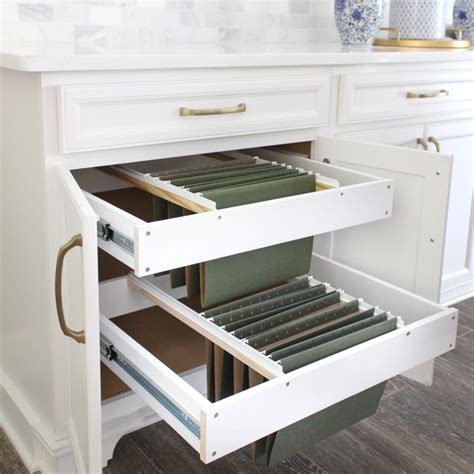 It also takes up floor space making the area look cluttered and untidy. DIY Hanging File Drawer in Kitchen Cabinet - Frills and Drills