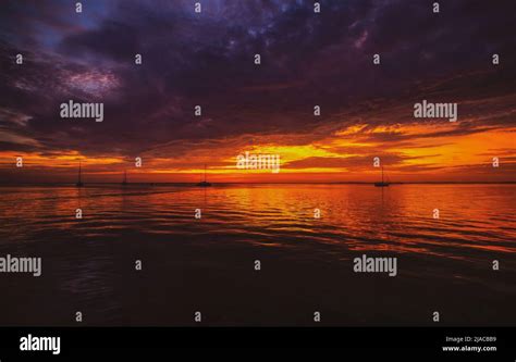Early Morning Sunrise Over Sea Sunset Reflecting Stock Photo Alamy