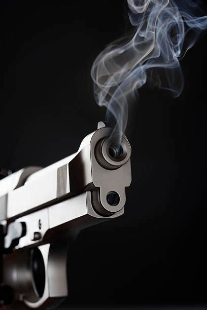 Smoking Pistol Stock Photos Pictures And Royalty Free Images Istock