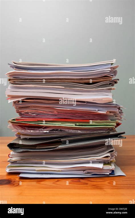 A Pile Of Old Office Files And Paperwork On A Desk Stock Photo