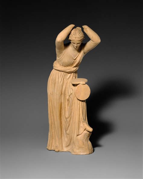 Terracotta Statuette Of A Woman Fixing Her Hair And Looking Into A Box