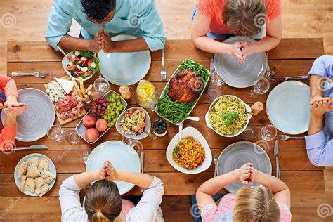 Group Of People At Table Praying Before Meal Stock Photo Image Of