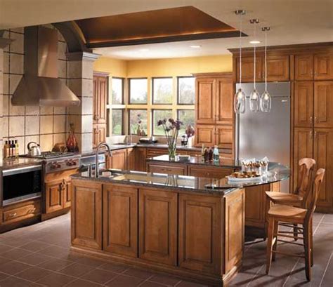 Available in stains and painted finishes. StarMark Cabinetry Sonoma door style in Maple finished in Caramel with Chocolate glaze ...