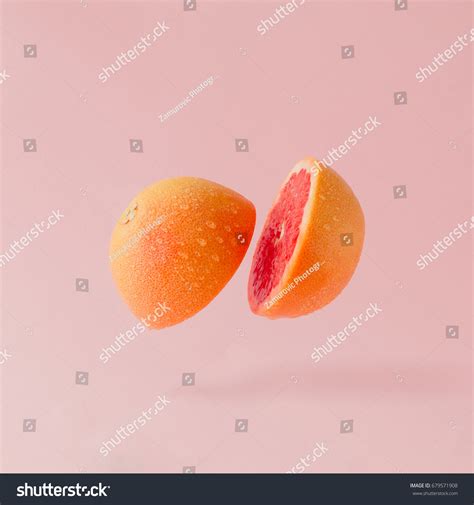 Grapefruit Sliced On Pastel Pink Background Stock Photo Edit Now