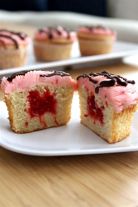 Line 36 muffin cups with paper liners.in a large bowl, mix together the flour, sugar, cocoa, baking soda and 1 teaspoon salt. Baked Perfection: Strawberry filled Vanilla Cupcakes with ...