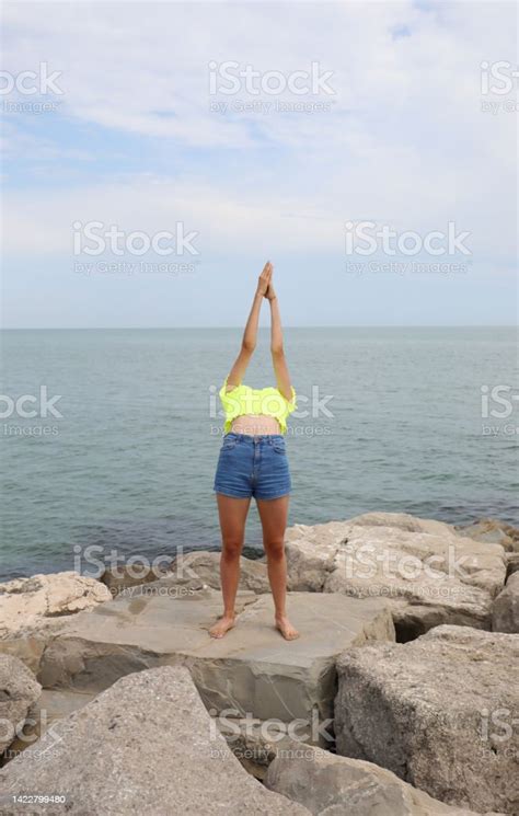 Girl In A Shirt Giving A Gymnastic Exercise Arching Her Back Backwards And Her Head Is No Longer