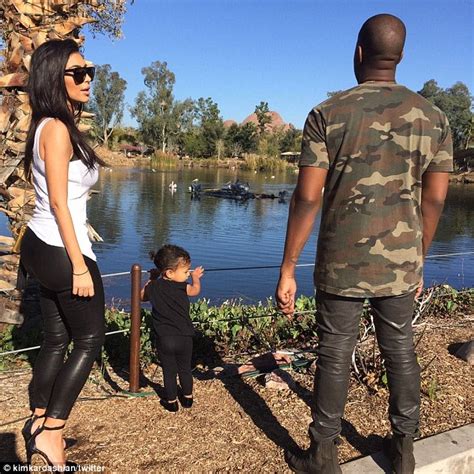 North West Mimics Kim Kardashians Facial Expression And Stylish Topknot Daily Mail Online