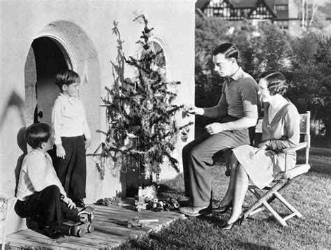 Full Shot Of Buster Keaton Seated By Christmas Tree With Wife Natalie