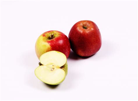 One Slice Of Green Apple And Two Red Apples High Quality Free Stock