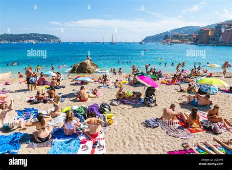 Crowded Mediterranean Summer Beach In Villefranche Sur Mer