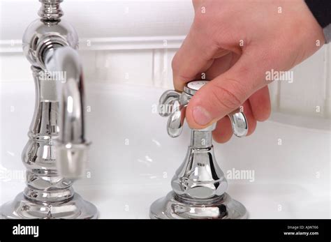 Hand Turning Tap Stock Photos And Hand Turning Tap Stock Images Alamy