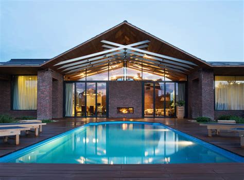 They are installed from one gable end of the house the trusses themselves hang over the outside walls of the house, creating the eaves. Exposed Trusses Create Artistic Composition within Brick ...