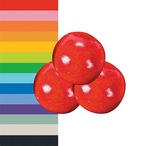 Three Red Apples Sitting On Top Of Each Other In Front Of A Rainbow