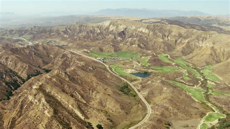 1080 Stock Footage Aerial Video Approach Golf Course And Brown Hills In