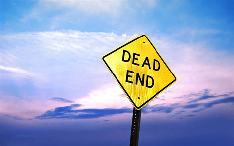 Download Ironic Sign Board Reminding The Dead End Wallpaper
