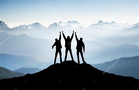 Team Silhouettes On Mountain Top — Stock Photo © Biletskiye 70200907
