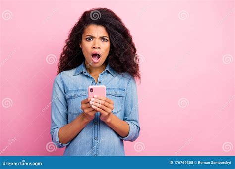 Portrait Of Amazed Social Media Lover Addicted Afro American Girl Blogger Use Smart Phone Get