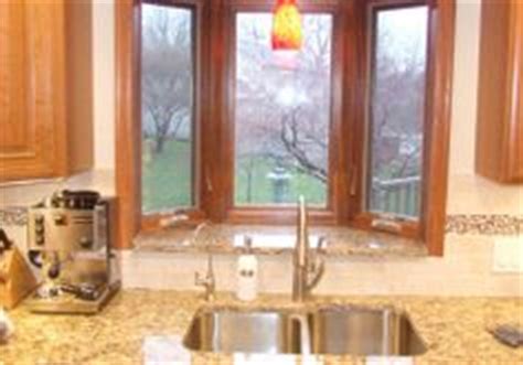 My old house had a huge window above the sink, but it had a several inch high backsplash that was really a bit awkward to keep i love the black windows over the kitchen sink and i would like to know where to get them. bay window over kitchen sink - Google Search