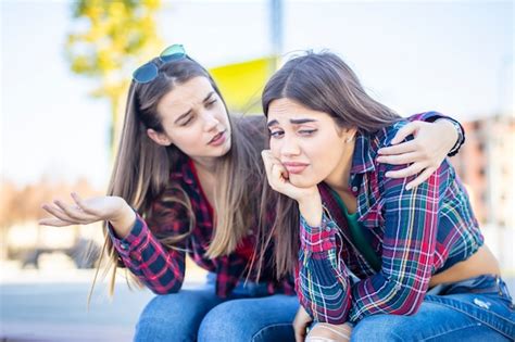 Premium Photo Young Woman Comforts A Sad Female Friend