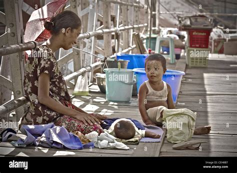Mother And Child In The Streets Of Rangoon Myanmar Stock Photo Alamy