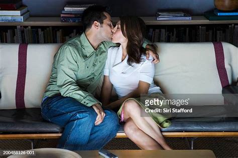 couple making out on couch photos and premium high res pictures getty images