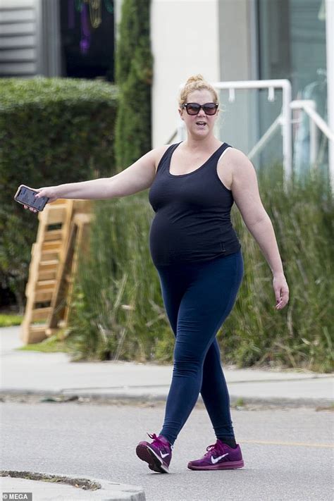Amy Schumer Shows Off Her Blossoming Bump During Stroll With Husband