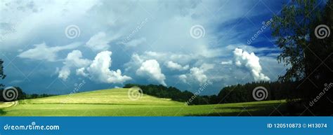 Scenic Landscape With Storm Cloud In Background Over Green Agriculture