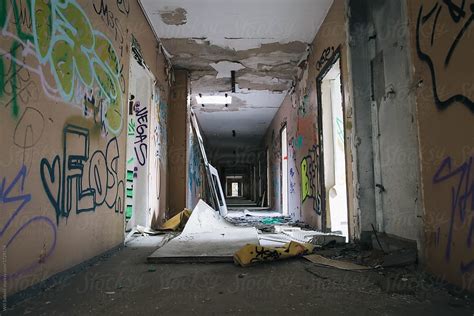 Abandoned Hallway Of Apartment Building With Graffiti By Willy Able