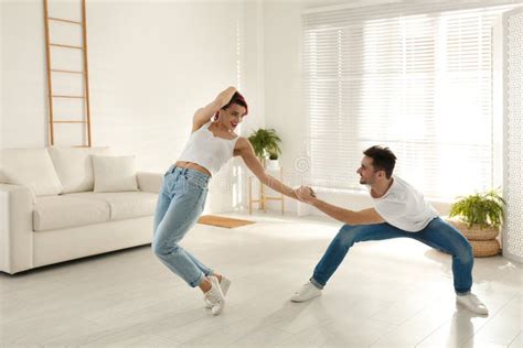 Beautiful Young Couple Dancing In Living Room Stock Image Image Of