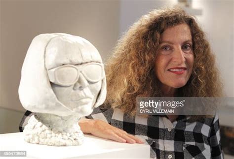 French Fashion Designer Nicole Farhi Poses For Pictures With Her